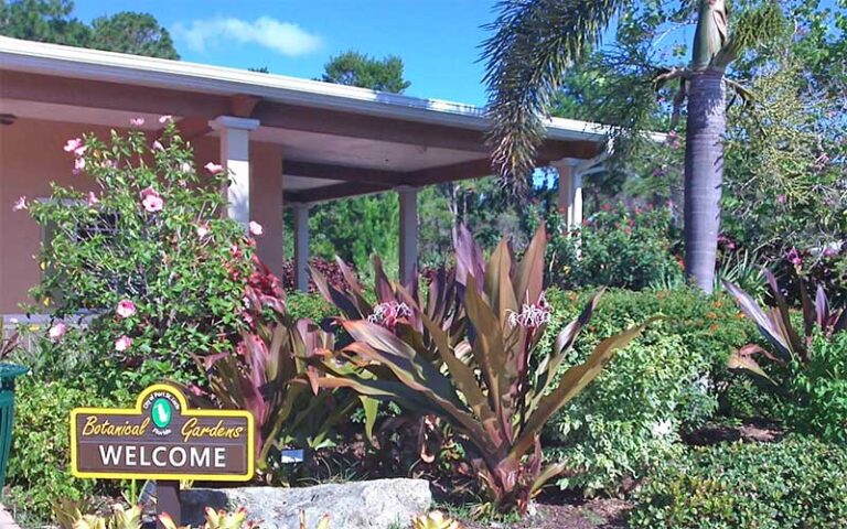 entrance with welcome sign and plants at port st lucie botanical gardens