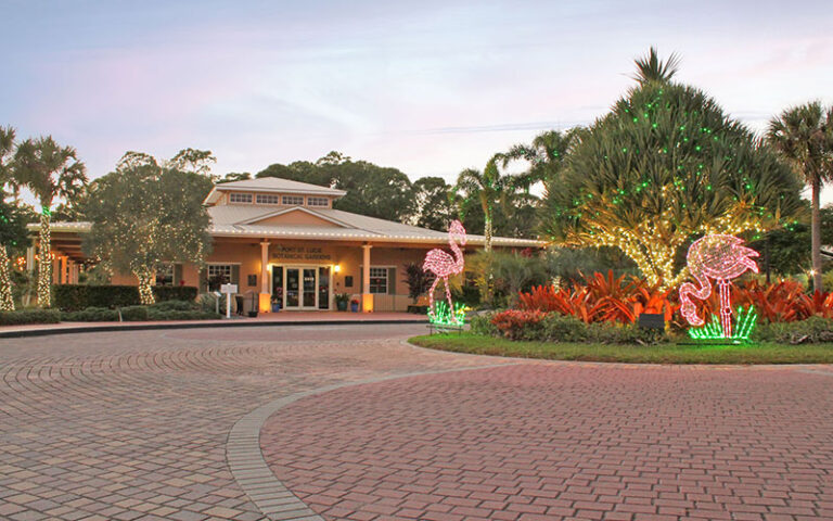 exterior from driveway with holiday lights at dusk at port st lucie botanical gardens