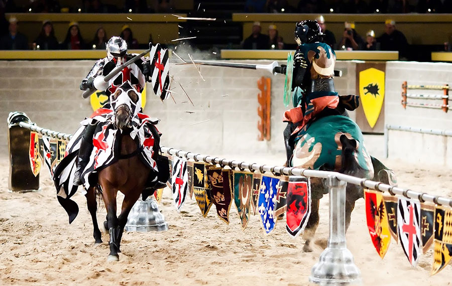 jousting knights on horseback with shattered lance in corral area medieval times dinner tournament kissimmee