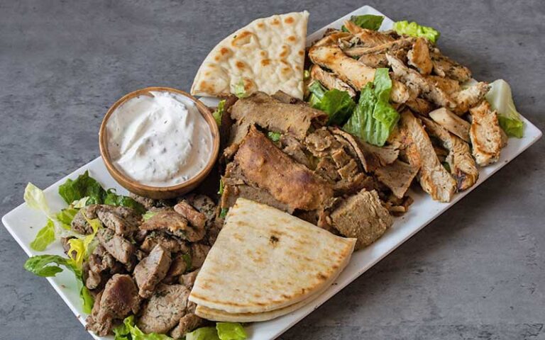 large rectangular platter with gyros and pita at spiros taverna of st lucie west