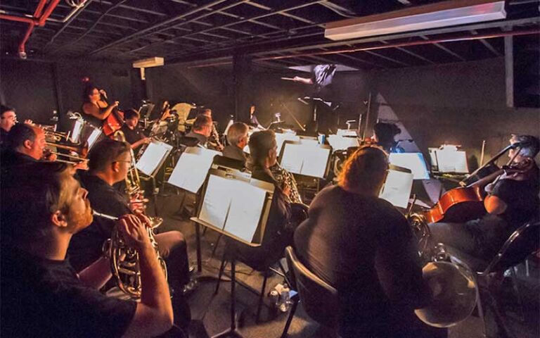 orchestra on stage playing at historic cocoa village playhouse