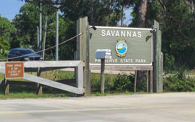 roadside park sign with hours and gated parking at savannas preserve state park port st lucie