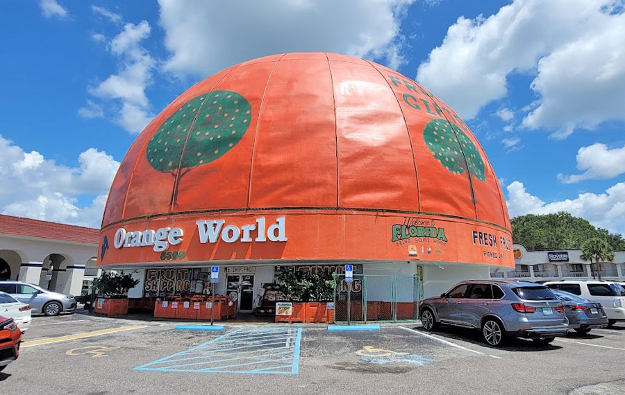 roadside store with giant orange domed roof and parking area elis orange world kissimmee