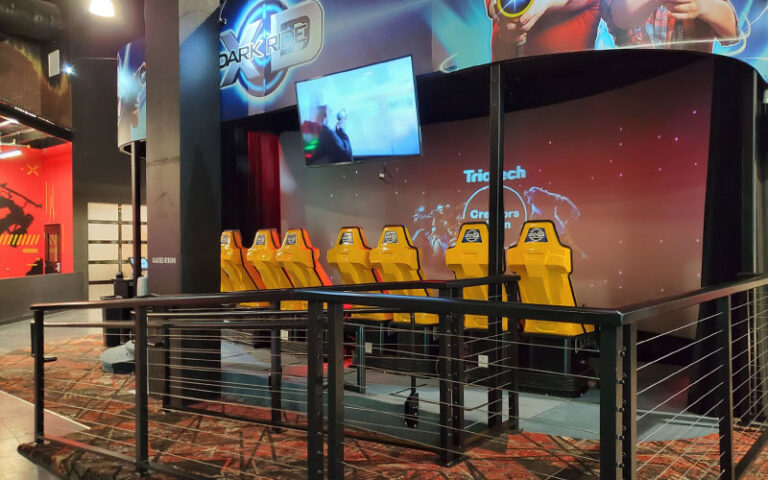 row of 4d ride seats with screen at route 7 karting entertainment rockledge