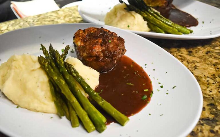 steak entree with asparagus at tutto fresco restaurant port st lucie