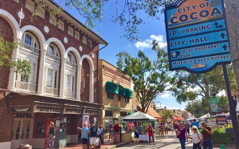 street exterior of theater building with sign at historic cocoa village playhouse
