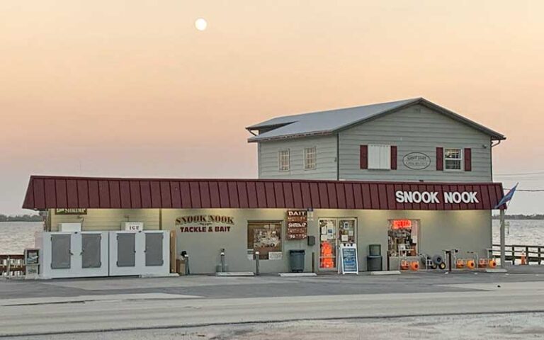 street view exterior of shop with water and early sun background at snook nook discount bait tackle jensen beach