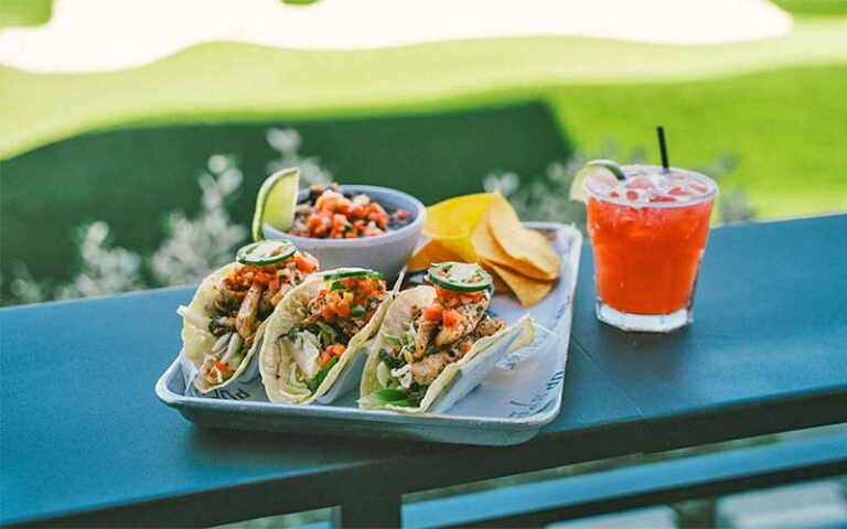 tacos with cocktail drink on patio at popstroke port st lucie