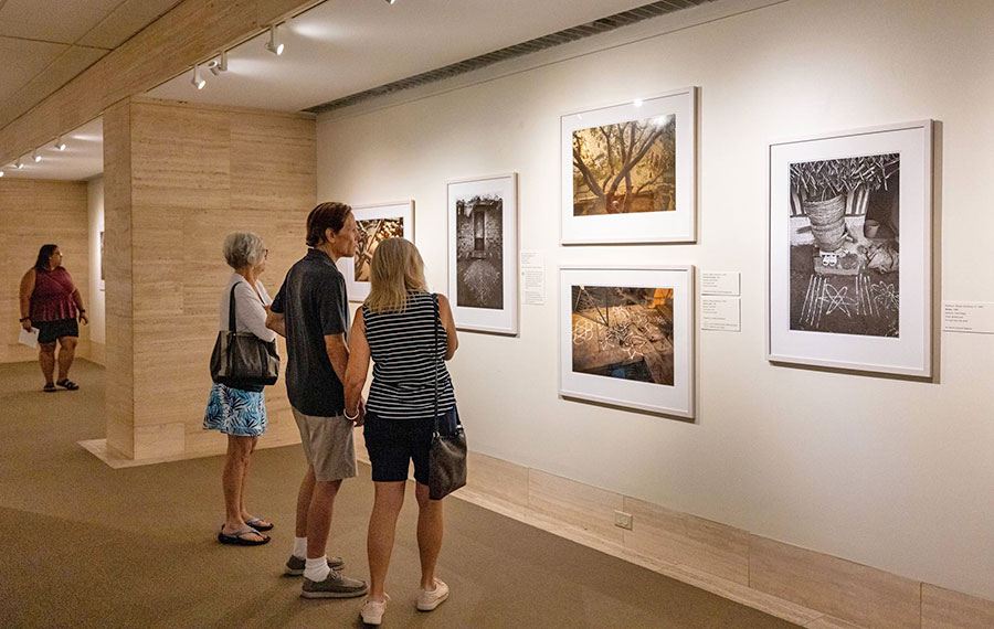 viewers looking at wall art in gallery at appleton museum of art ocala