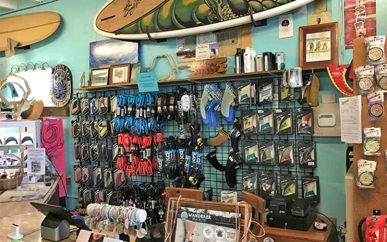 wall rack with board accessories at spunkys surf shop fort pierce