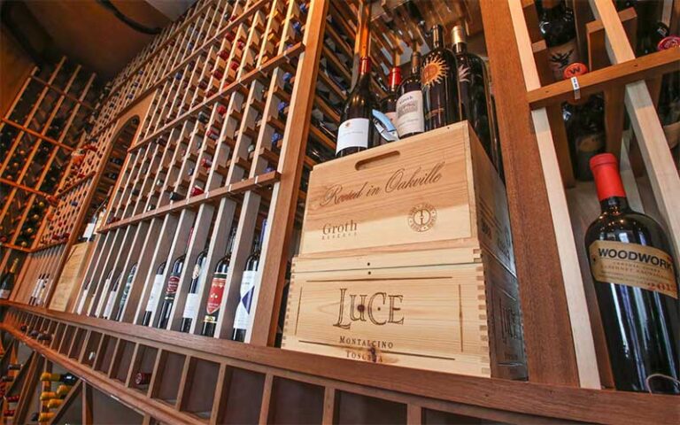 wine shelves along wall at tutto fresco restaurant port st lucie