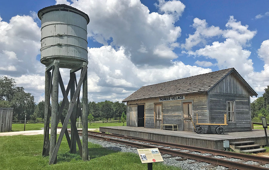 wooden train depot with water tower at pioneer village osceola history