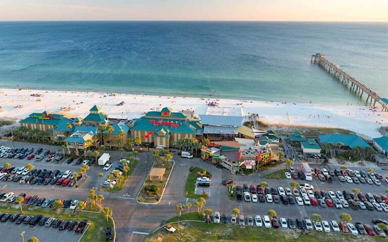 aerial view of complex on beach with pier at the boardwalk at okaloosa island