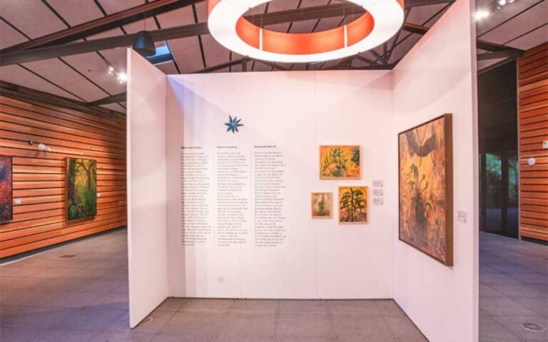 art exhibit in building with halo light at naples botanical garden
