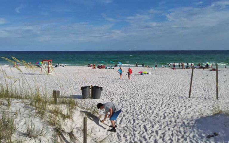 beach with people and ocean at john beasley park fort walton beach