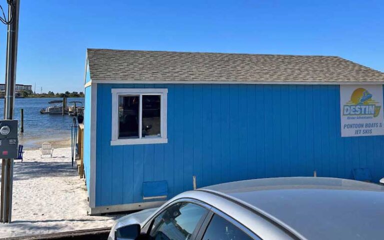 building on lake shore with sign at destiny water adventures fort walton beach