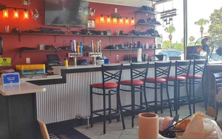 dining area with bar at outcast seafood miramar beach