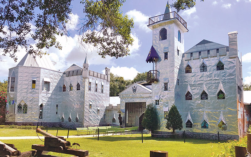 exterior day view of aluminum crafted medieval building with cannon solomons castle ona