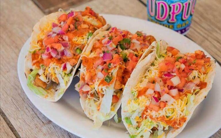 fish tacos entree with drink at fudpuckers beachside bar grill destin