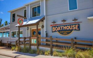 front exterior of restaurant with sign at stuart boathouse
