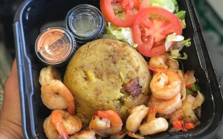 handheld tray with shrimp plate and sides at the mofongo king port st lucie