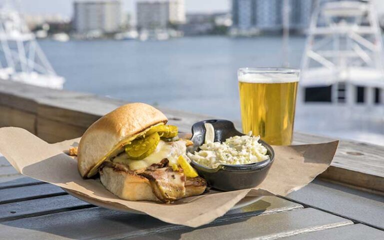 harborview dining table with grouper sandwich entree at boshamps seafood oyster house destin