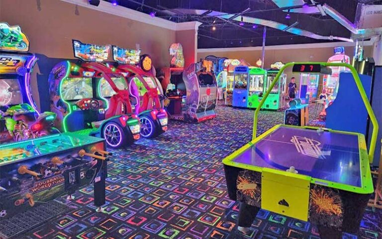indoor arcade with air hockey and games at rainforest black light golf arcade miramar beach
