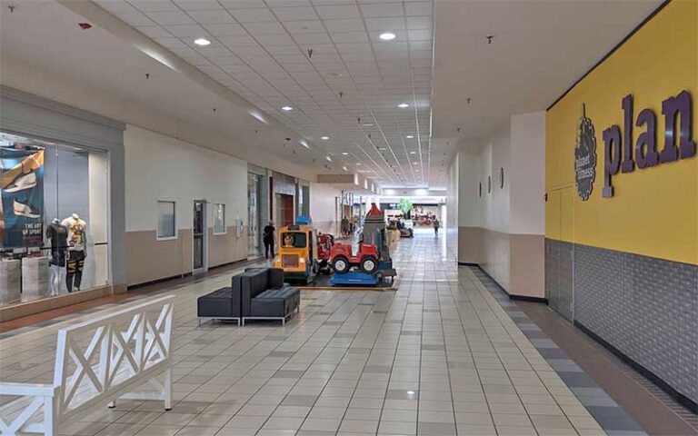 indoor hallway with stores and kiddie rides at santa rosa mall mary esther