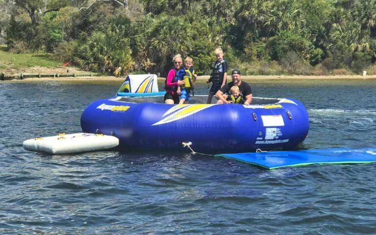 inflatable floating trampoline with family on lake at destiny water adventures fort walton beach