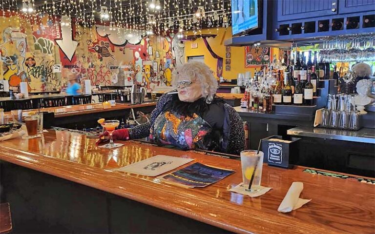 interior bar with string lights and statue at old bay steamer fort walton beach