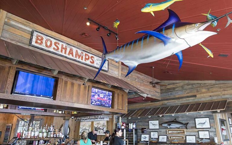 interior bar with vaulted ceiling marlin fish decor at boshamps seafood oyster house destin