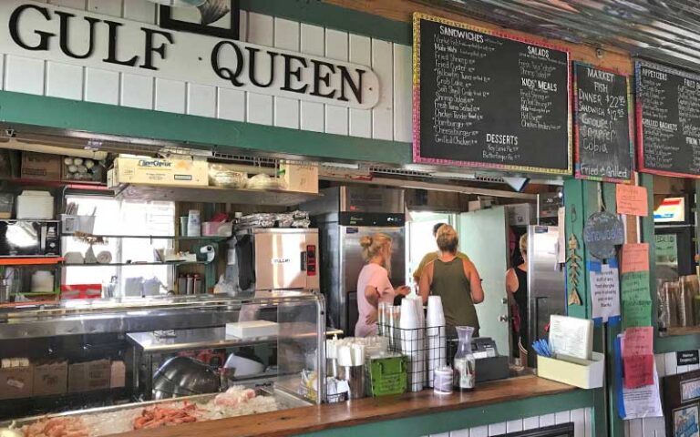 order counter with menus and seafood display at dewey destins seafood restaurant