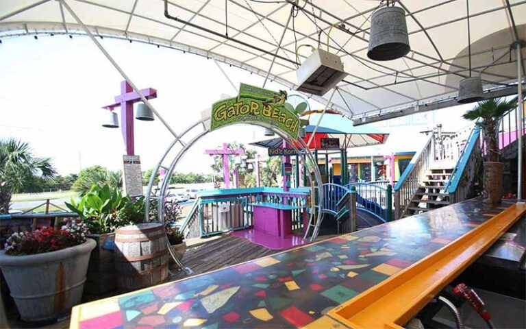 outside stage with gator beach entrance at fudpuckers beachside bar grill destin