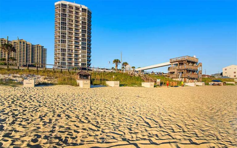 sandy beach with skywalk bridge to condos at surfside resort miramar beach