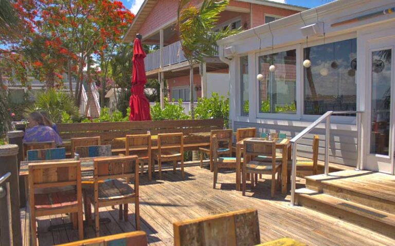shady patio dining with trees at stuart boathouse