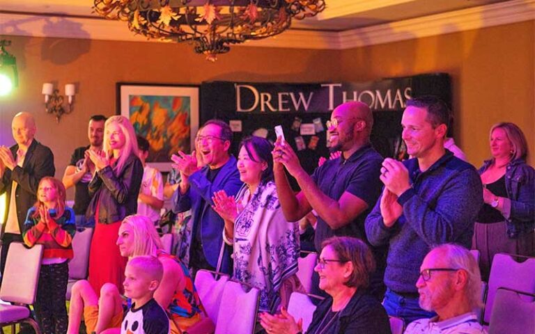 standing crowd with surprised expressions at the magic show at grande lakes orlando