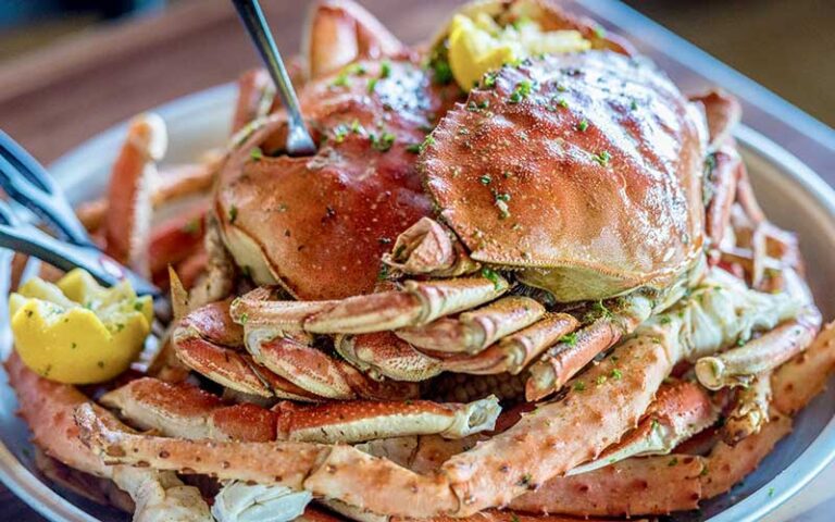 stuffed crabs and legs piled on platter with lemon at brotulas seafood house steamer destin