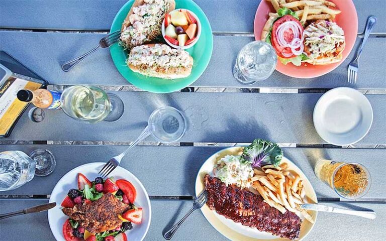 tabletop with lobster roll and ribs entrees at snook inn marco island