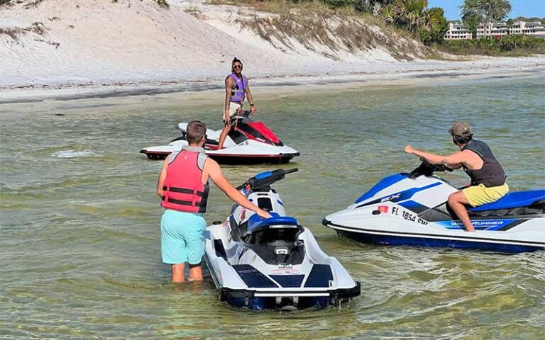 three people with jet skis on lake at destiny water adventures fort walton beach