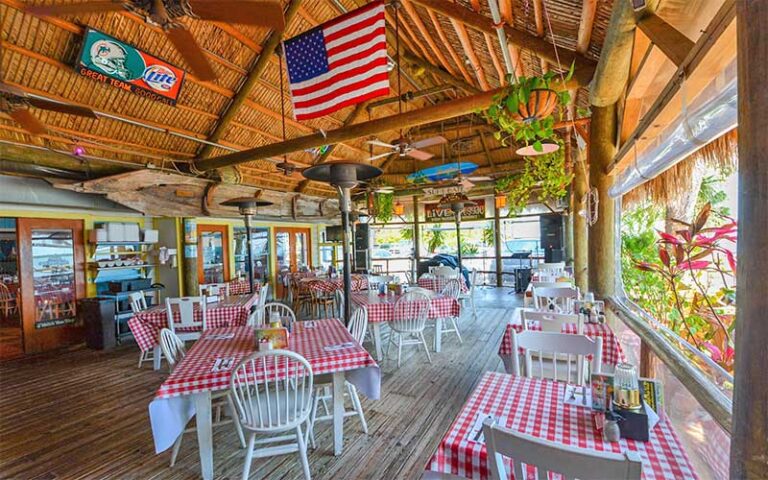 tiki roofed dining patio at conchy joes seafood jensen beach