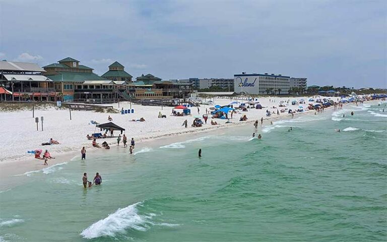 view from pier of beach and shops at the boardwalk at okaloosa island