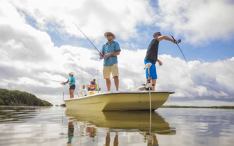 group standing on small craft fishing for bass homosassa river florida