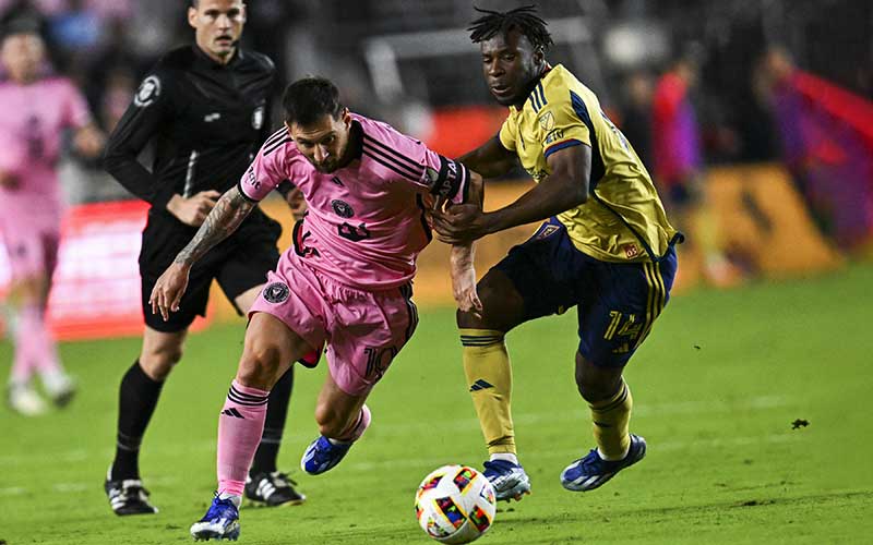 miami soccer player chasing ball with referee at game inter miami cf