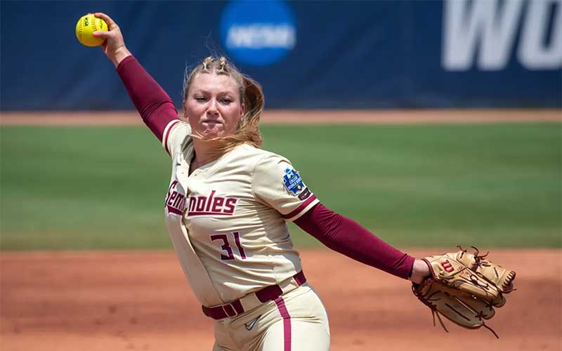 player winding fast pitch with yellow softball for womens florida seminole team game