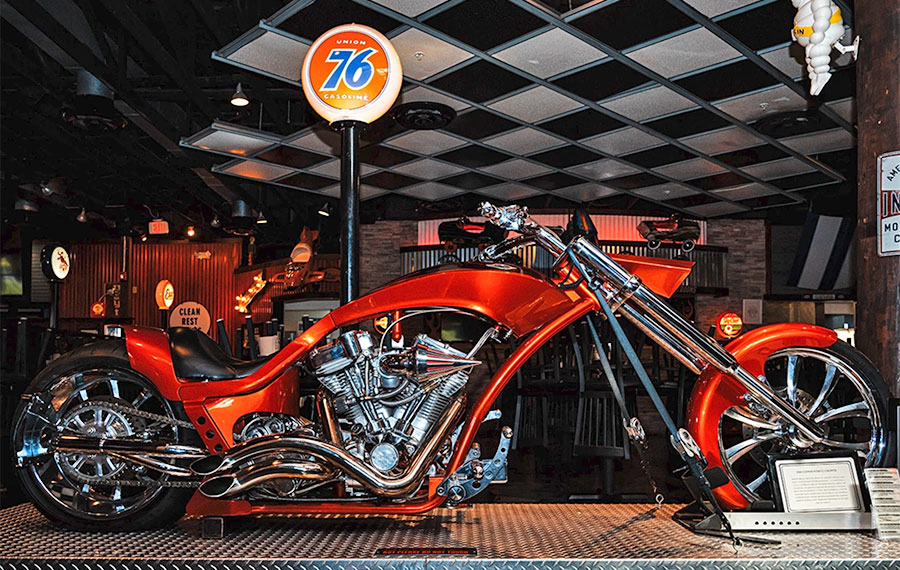 concept motorcycle chopper display interior dining area with 76 gas pump at wicked wheel panama city beach