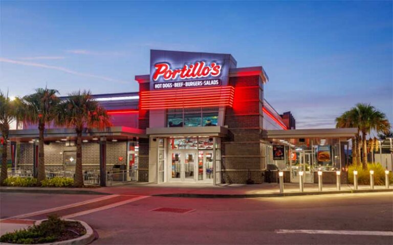 exterior night front of restaurant at portillos orlando palm pkwy