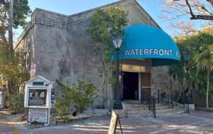 front exterior of theater with sign and awning at waterfront playhouse theater key west