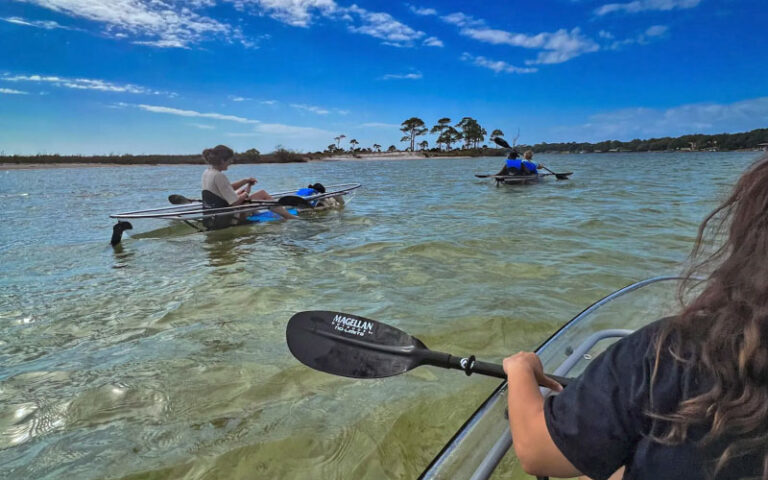 group kayaking across inlet at get up and go kayaking destin