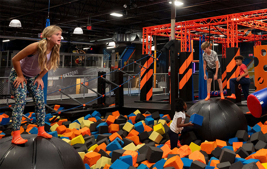 kids playing in obstacle area with multi colored foam cubes in sky zone trampoline park fort myers