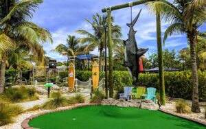 mini golf course with hanging shark gateway at lighthouse cove adventure golf jupiter